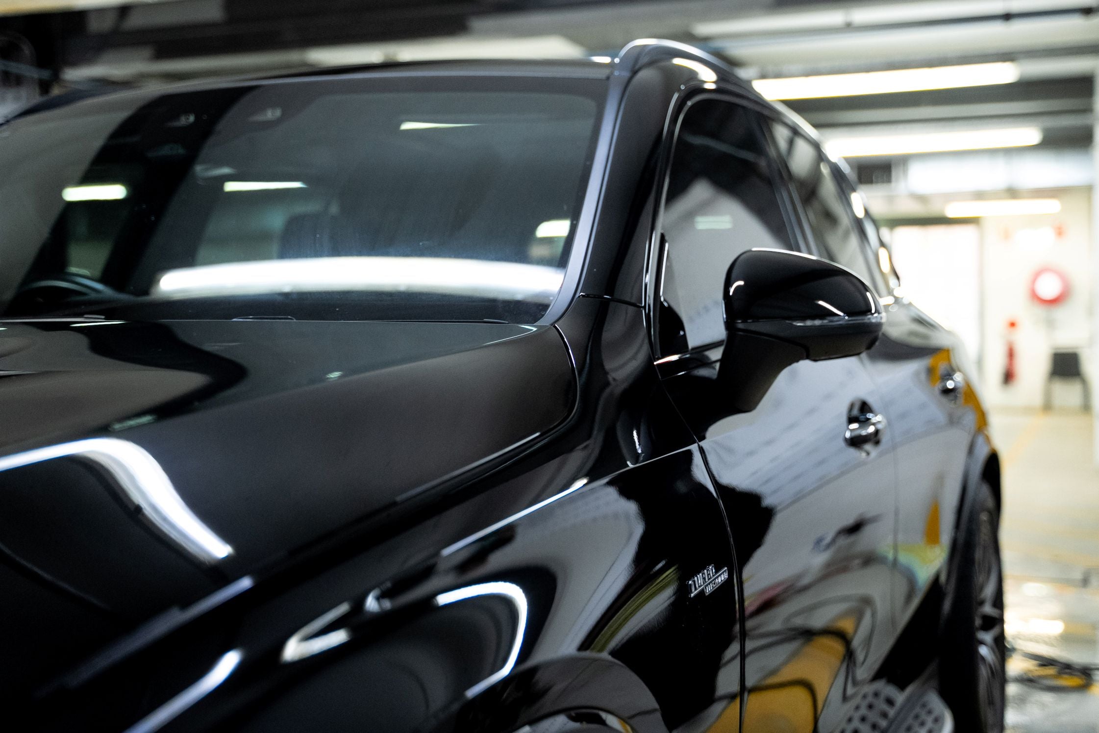Black SUV with professionally tinted windows completed by GenTek.