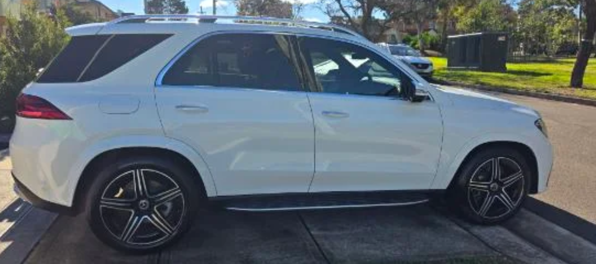 White Mercedes-Benz SUV parked on a driveway
