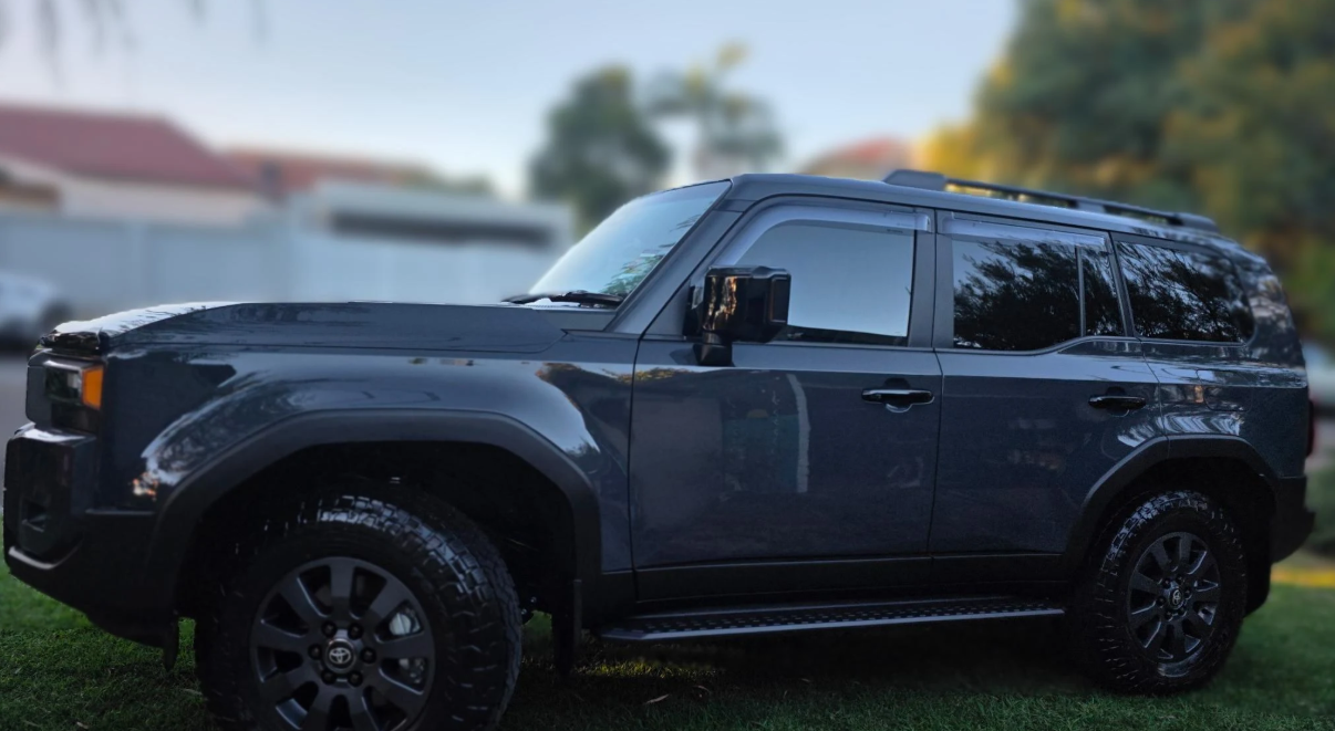 Black SUV parked outdoors with a blurred background