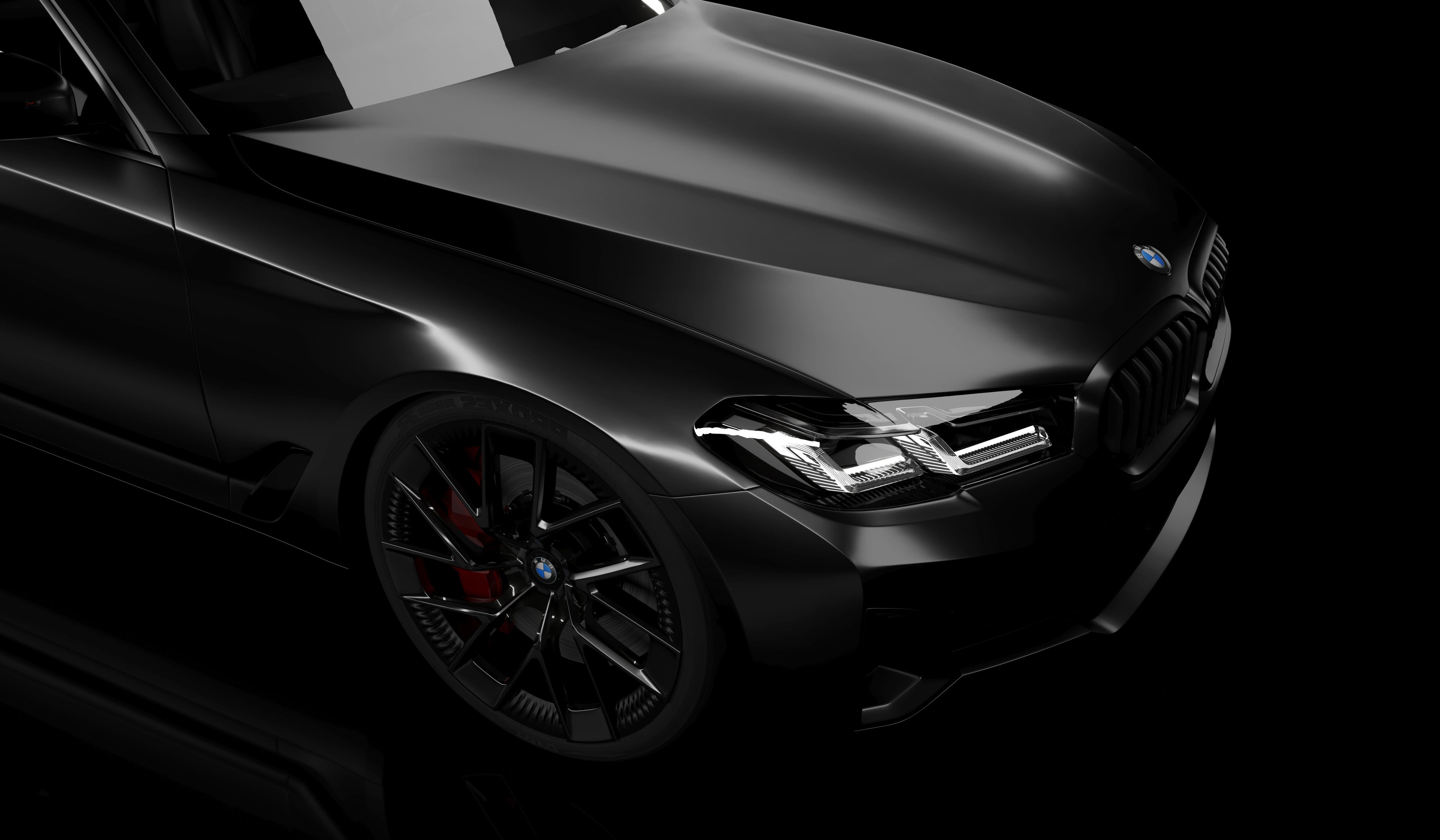 Black BMW with a deep gloss finish highlighting the appearance of ceramic-coated paintwork.