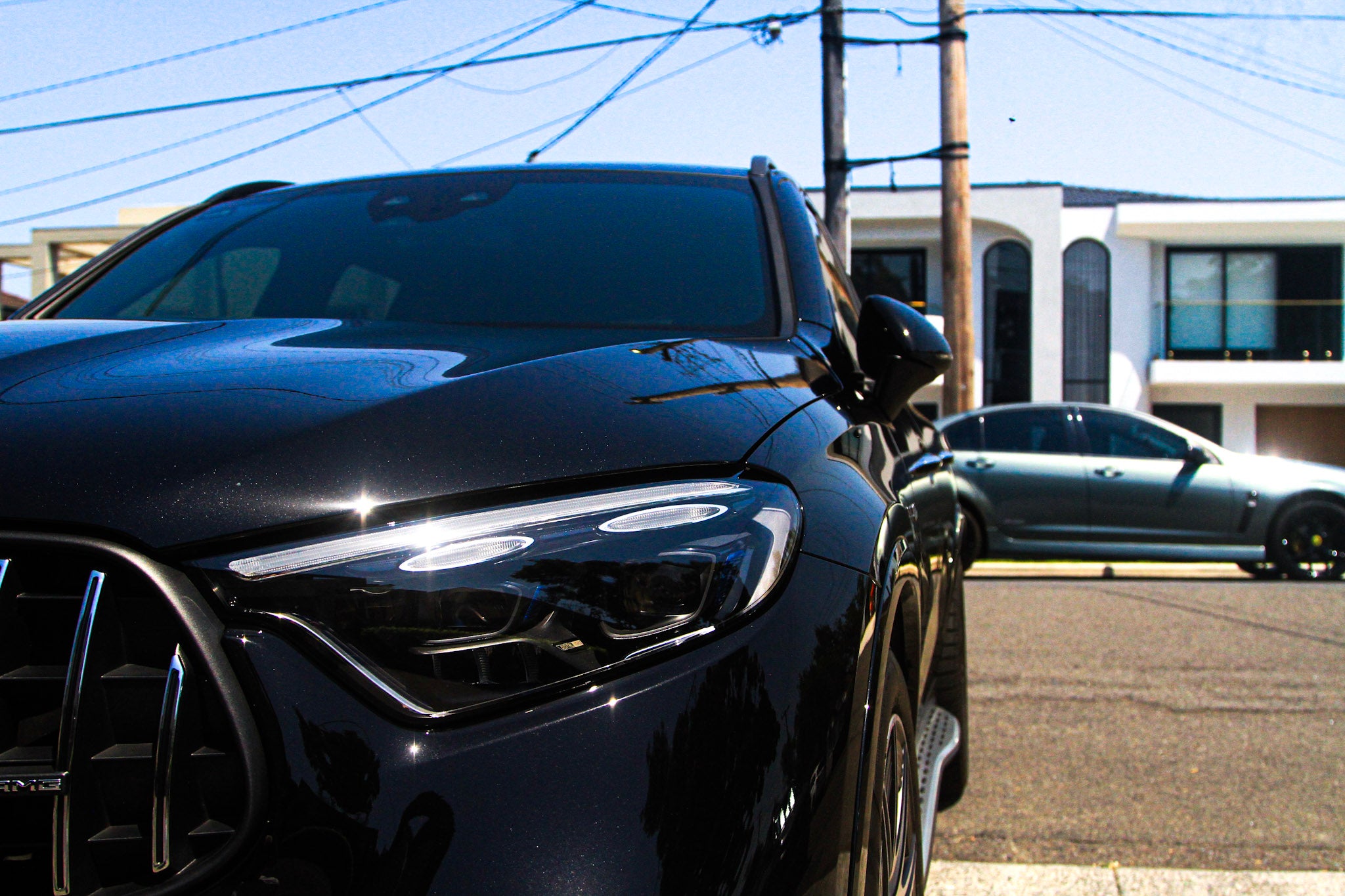 Black Mercedes SUV with professionally tinted windows providing a sleek, darkened finish.