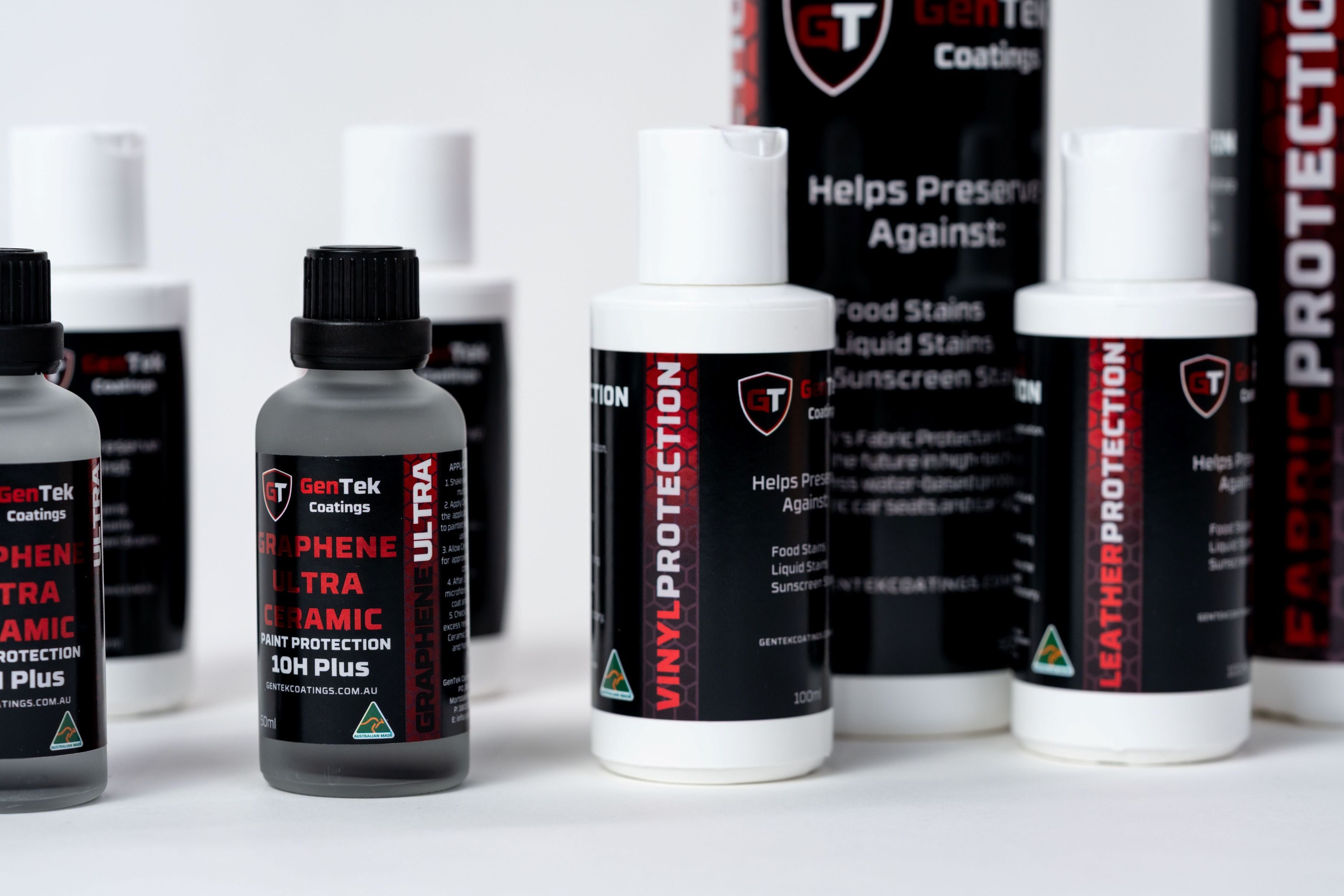 Close-up of GenTek graphene ceramic paint protection, vinyl protection and leather protection products.