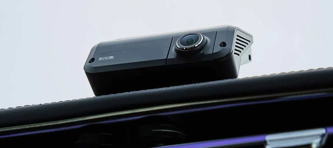 Gentek dash camera professionally installed inside a vehicle near the windscreen.