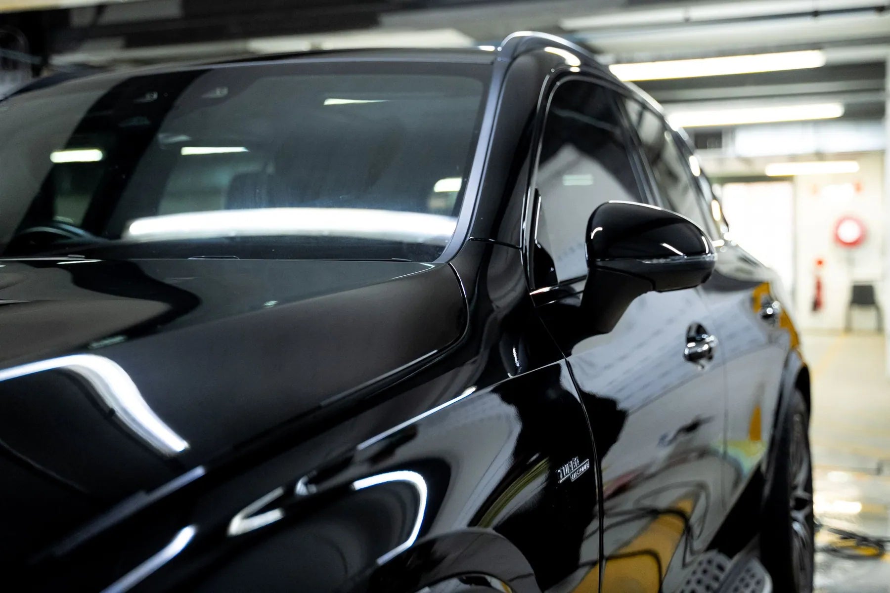 GenTek specialists beside customer cars